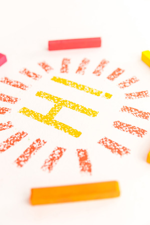 Cropped photo of word HI inside a frame made of bright and colorful pastel chalks, over white...