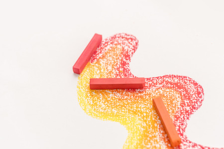 Close up photo of gradient made of pastel crayon chalks over the colorful traces isolated over the...