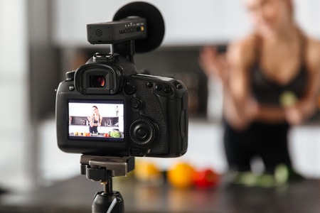 Close up of a camera recording healthy food tutorial indoorsの写真素材