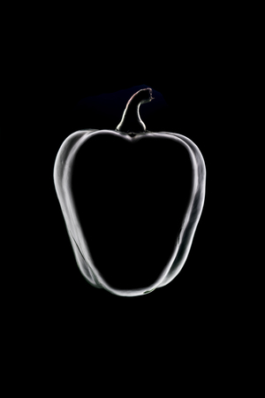 Outline of green bell pepper over black backgroundの写真素材