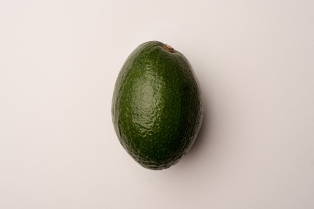 Ripe avocado isolated over white backgroundの写真素材