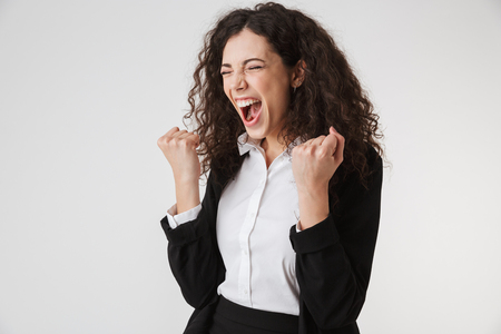 Portrait of an angry young businesswoman screaming isolated over white backgroundの写真素材