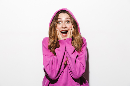 Portrait of young woman 20s wearing sweatshirt laughing isolated over white backgroundの写真素材