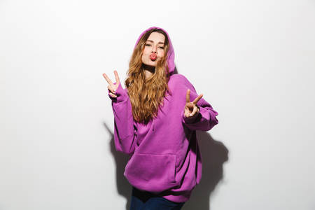 Portrait of european woman 20s wearing sweatshirt laughing isolated over white backgroundの写真素材