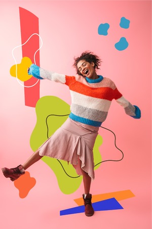 Image of a beautiful young african woman posing isolated over pink wall background.の写真素材