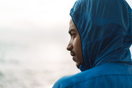 Photo of a strong handsome young african sports man outdoors at the beach sea.の写真素材