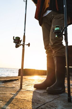 Close up of a fisherman catching fish at the seashore