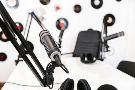 Image of a radio workspace workplace with microphone and sound equipment.の写真素材