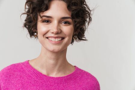 Image closeup of happy attractive woman smiling and looking at camera isolated over white background