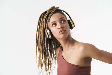 Attractive young african fitness sports woman standing isolated over white wall background,...
