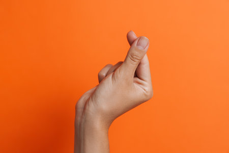 Woman's hand showing snapping gesture isolatedの写真素材