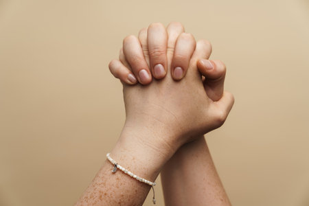 Woman's hands begging isolated over background