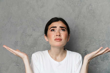 Shocked beautiful young woman screaming over isolated background