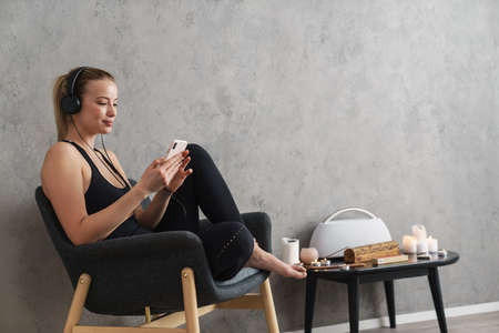 Yoga meditation at home. Relaxation concept with calm young healthy woman sitting in front of...