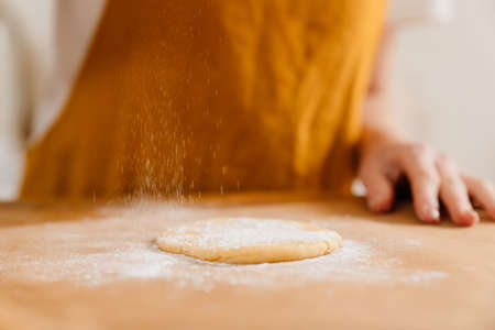 Caucasian pastry chef woman making cookies at cozy kitchen