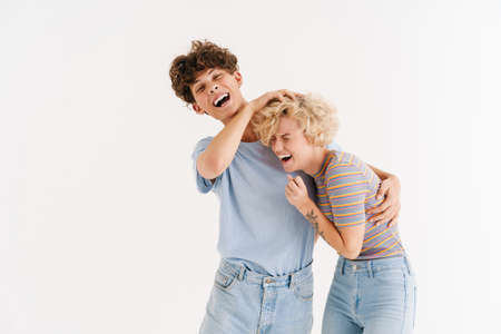 Image of positive young loving couple having fun isolated over white background