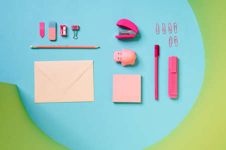The children's pink set for writing consisting of an envelope, a pen, a sharpener, paper clips and a...