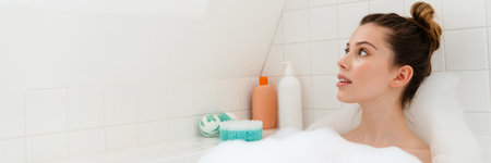 Young white woman relaxing in a bubble bath