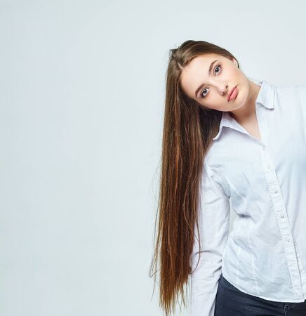 beautiful girl with very long hair on a white backgroundの写真素材
