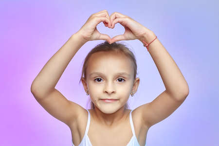 Little girl with glasses, holding a red Apple.