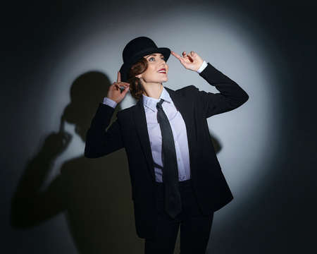 attractive young woman in a man's suit and a fedora. retro style photo shootの写真素材