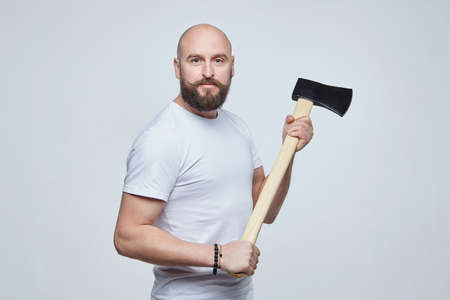 man holds a pair of scissors intending to cut his mustache. shaving conceptの写真素材