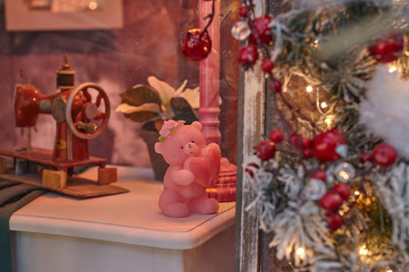 wax figure of a bear in love holding a heart in its paws. valentine's day concept.の写真素材