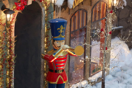 the figure of a trumpeter soldier in an old uniform in the winter city. the concept of Christmas and...