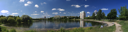 Panorama of the city lake, landscape against the blue skyの写真素材