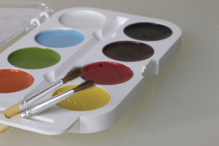 Watercolors and brushes for painting. On a white background.の写真素材