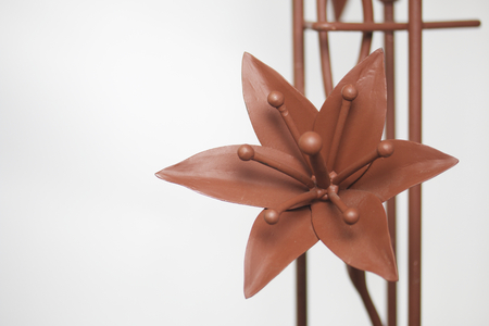 Forged metal products. Flowers and leaves are forged and coated with a primer. design elements. On a white background.の写真素材