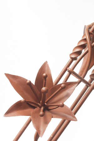 Forged metal products. Flowers and leaves are forged and coated with a primer. design elements. On a white background.の写真素材