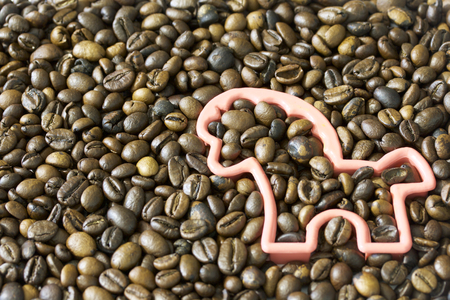 Roasted grains of black coffee. Shape of animals on the background of coffee beans.の写真素材