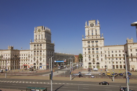 Buildings tower at Railway Square in Minsk, Belarus. "Gates of Minsk" - two 11-storey building towers at the corners of a 5-storey buildings, arranged symmetrically with respect to the transverse axis of the Station Square (the station building - Kirov stのeditorial素材
