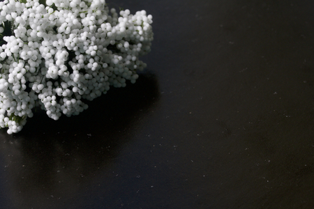 Ornaments for celebrations. Bouquet of artificial flowers from white foam. Located in the left corner of the frame.の写真素材