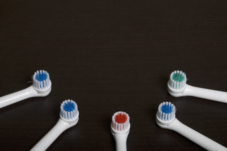 Nozzles for electric toothbrush. Lie on a dark surface.の写真素材
