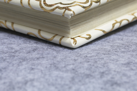 A festive photo album rests on a light gray felt background. The back of the photo album is visible.