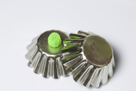 Decoration for baking in the form of raspberries. It is worth on inverted metal forms for baking cake. On a white background.の写真素材