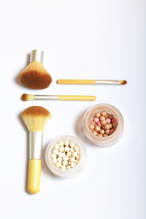 Beauty knolling. Brushes for applying makeup of different sizes and highlighter.の写真素材