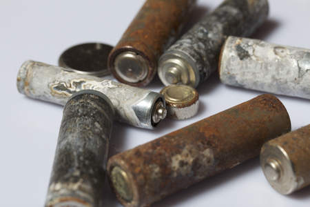 The fulfilled batteries of the different size covered with corrosion. Recycling.の写真素材