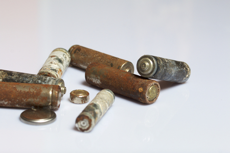 Used finger-wound batteries covered with corrosion. Recycling.の写真素材
