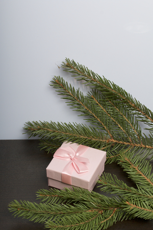 Wrapping presents. Gift boxes. Nearby are green branches of spruce.の写真素材