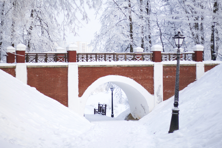 The bridge, made in the old style. Everything around is covered with thick frost.の写真素材