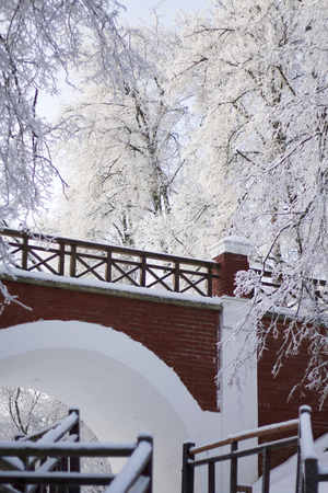 The railing of the bridge, made in the old style. Everything around is covered with thick frost.の写真素材