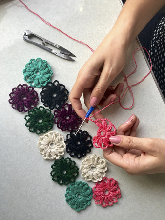 Crochet jewelry for women. Earrings knitted by an entrepreneur. Threads for knitting, billets and...