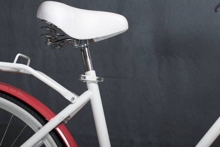 Elements of a female bicycle in white and pink color.  Trunk, seat and wheel. Spring and summer recreation and sports.の写真素材