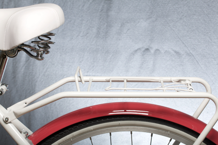 Elements of a female bicycle in white and pink color.  Trunk, seat and wheel. Spring and summer recreation and sports.の写真素材