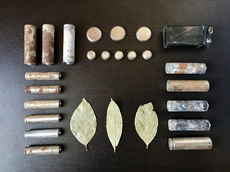 Corrosion-free batteries.  Different size and shape. A dry leaves.  Recycling and environmental...
