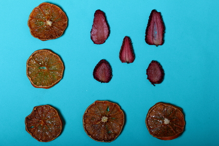 Tangerines and strawberries are cut into slices and dried to decorate desserts.の写真素材