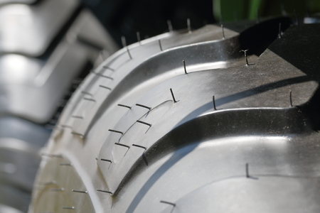 Agricultural vehicle tire wheel. Visible protector. Close-up.